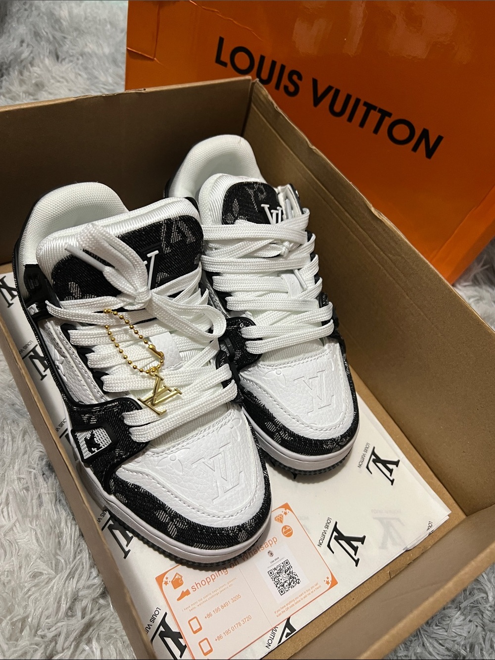 Louis Vuitton Black and White Men’s Low-Top Sneakers with Gold LV Charm